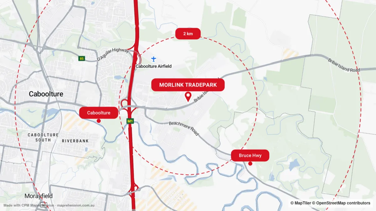 A map styled in CPM red and charcoal, with a site pin and 2, 5, 10 and 25 km radius rings around an industrial estate north of Brisbane